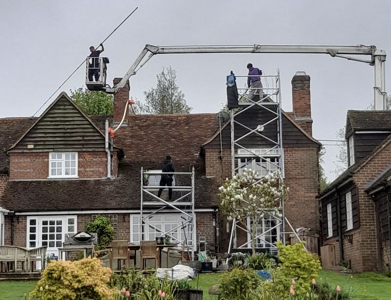The Roof Moss Cleaners using cherry picker and scaffolding to clean roof safely and professionally in Yate, Gloucestershire